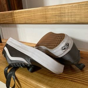 Silver woman’s Vans. Size 8.5 with matching silver ribbon laces